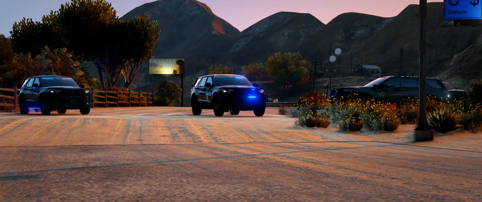 Three patrol Explorers rolling up at sunset